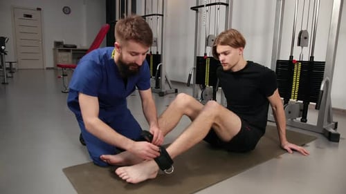 Athlete Male Patient in Clinic Sport Physical Therapy Concept