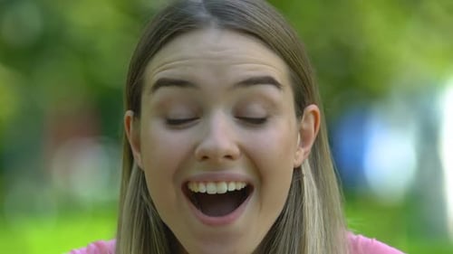 Extremely Happy Girl Looking Into Camera, Shocked With Information, Close-Up