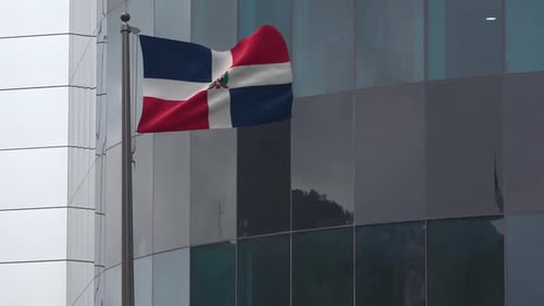 Waving Dominican Republic Flag on Modern Building Background