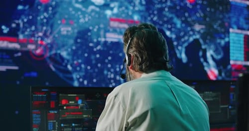 Mature Programmer Working in Digital Security Center