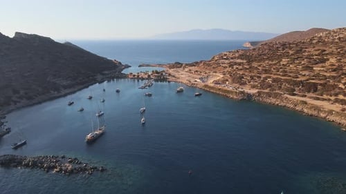 Sailing Yachts Anchored in the Bay with Clear and Turquoise Water