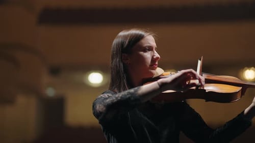 Young Woman is Playing Violin on Scene of Music Hall Portrait of Violinist in Philharmonic Hall
