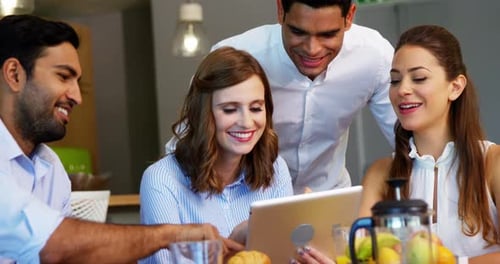 Executives using digital tablet