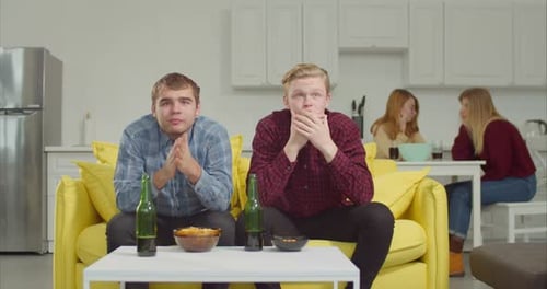 Men Reacting to a Game with Friends