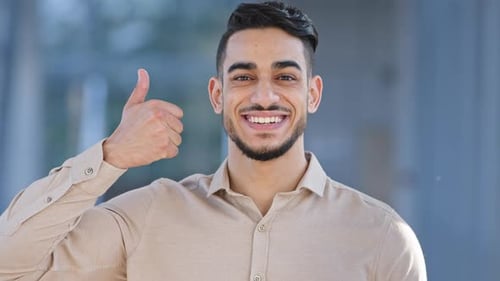 Young Man Gives a Thumbs Up Gesture