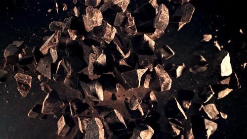 Chunks of Dark Chocolate Flying in the Air