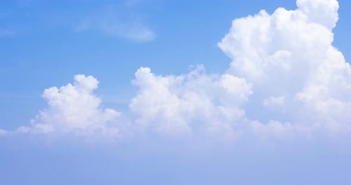 Fluffy White Clouds in a Clear Blue Sky