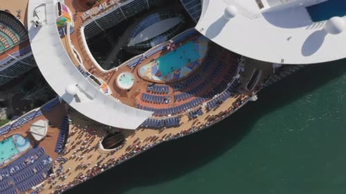 Aerial Drone View of White Ship with Entertainment Center on the Upper Deck