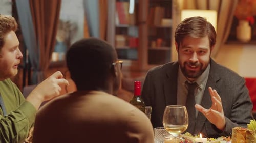 Friends Gather Around Table for Dinner Party
