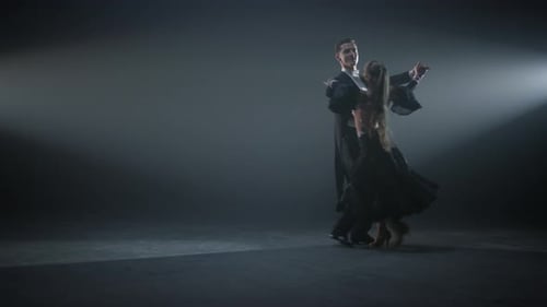 Ballroom Couple Dancing Valse on Dark Stage