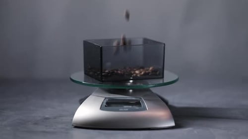 Coffee Beans Being Weighed on a Digital Scale