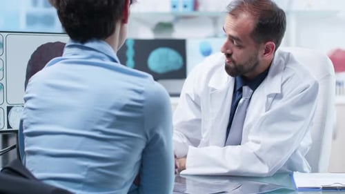 Doctor Consulting with Patient in Bright Office