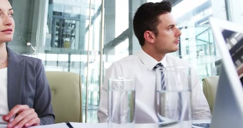 Business People in Modern Office Attending Meeting