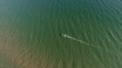 Aerial Shot of a Wooden Boat Fishing on the Black Sea Shallow in Summer