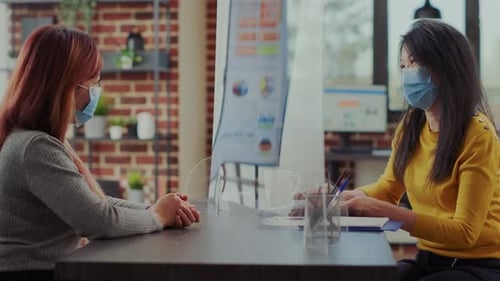 Two Women Meeting in Office Wearing Masks