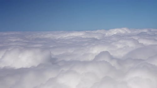 Sea of Clouds From Airplane Window