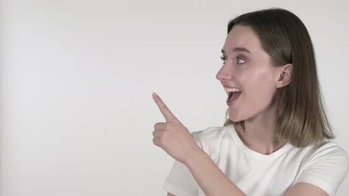 Smiling Woman Pointing to the Side