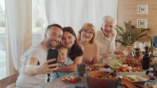 Family Takes Selfie at Birthday Dinner Gathering