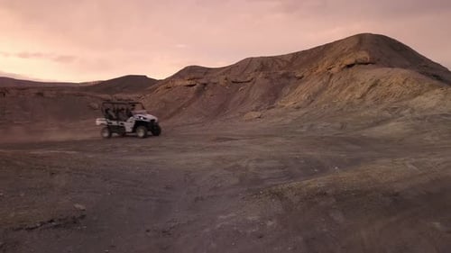 Women in OHV driving through the desert