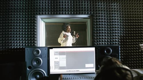 Black Female Singer Recording Song in Studio