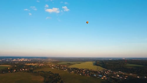 Hot Air Balloon in the Sky Over a Field.