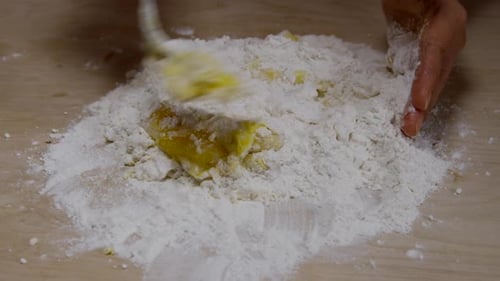 Making Dough, Adding Egg to Flour Mixture