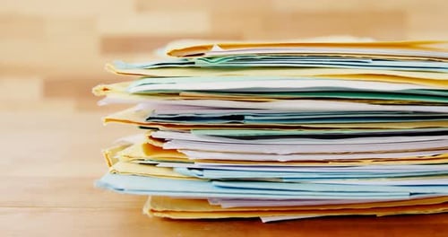 Stack of Colorful File Folders on Desk