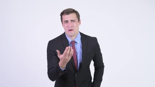Man in Suit Gesturing Frustration