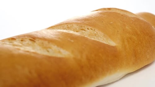 Golden Baguette on White Surface, Close Up