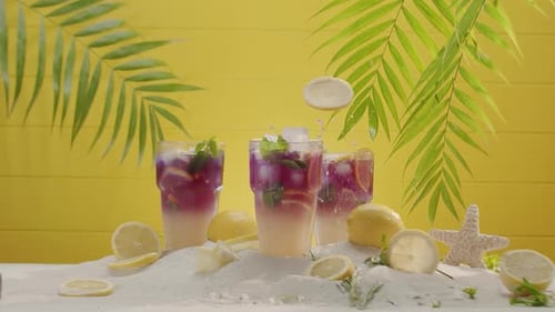 Refreshing Citrus Beverage with Lemons and Palm Fronds