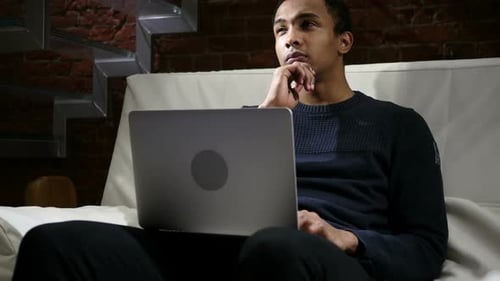 Man on Laptop at Home