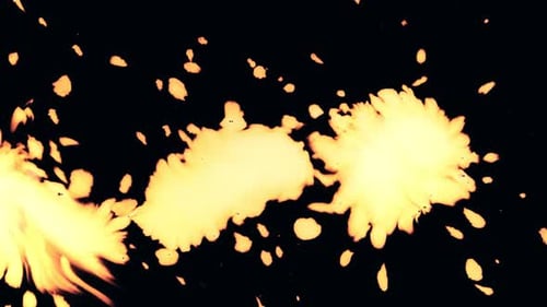 Yellow-Orange Paint Splatters on Black Background