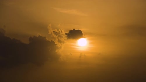 Sun Setting Behind the Clouds at Sunset