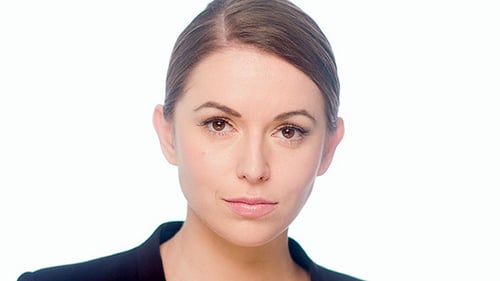 Woman Smiling and Looking at the Camera