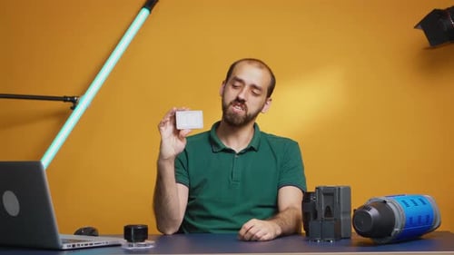 Man With Card Talking in Studio