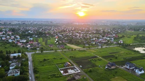 Aerial View of Residential Houses in Suburban Rural Area at Sunset