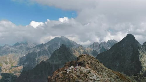 AERIAL Mountain Summit Reveal, beautiful view over mountain tops with epic landscape