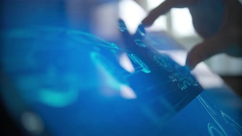 Fingers Use Futuristic Blue Digital Interface