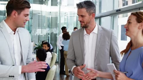 Business people shaking hands in office