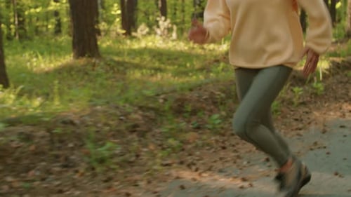 Young Woman Running in Park
