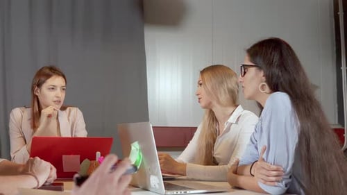 Three Women Are Discussing To Each Other at Business Meeting in Office