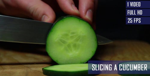 Cucumber Being Sliced with Knife on Cutting Board