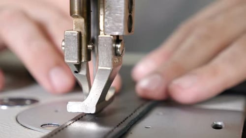 Craft Leather Workshop and Manufacture. Close-up of Master Sewing Pieces of Leather, Stitches Straps