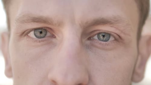 Blinking Eyes of Casual Young Man
