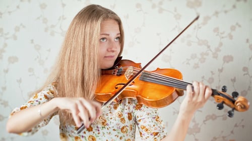 Teenager Playing the Violin