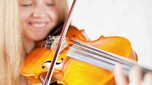 Young Woman Plays Violin, Close Up
