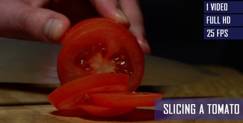 Tomato Being Sliced on Cutting Board Close Up