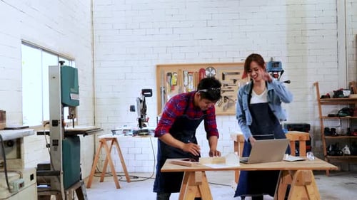 Time-lapse of Carpenter team working for wood construction project on drawing paper in workshop