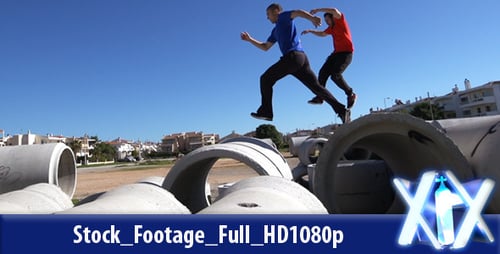 Athletes Perform Parkour on Concrete Tubes in Urban Area