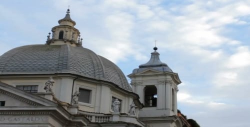 Ornate Church Dome and Towers Against Cloudy Sky